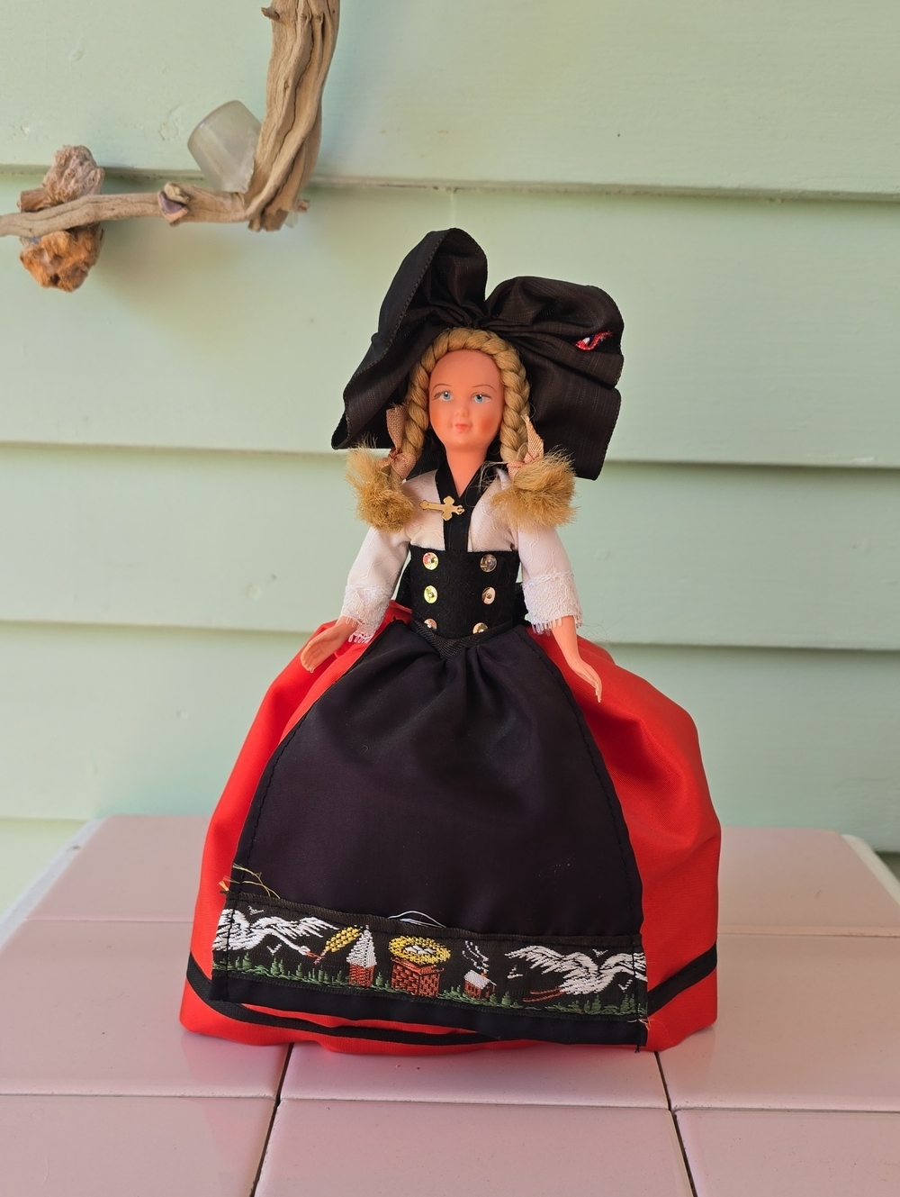 Vintage plastic souvenir doll in traditional Swiss or German folk costume